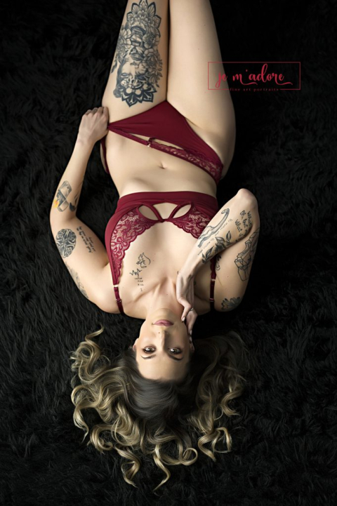 Artistic portrait of a woman posed upside down highlighting strength and sensuality